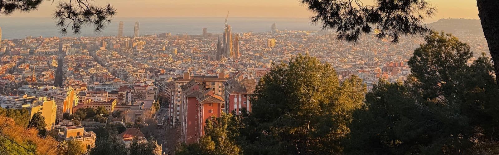 The city of Barcelona illuminated by the sunset. 